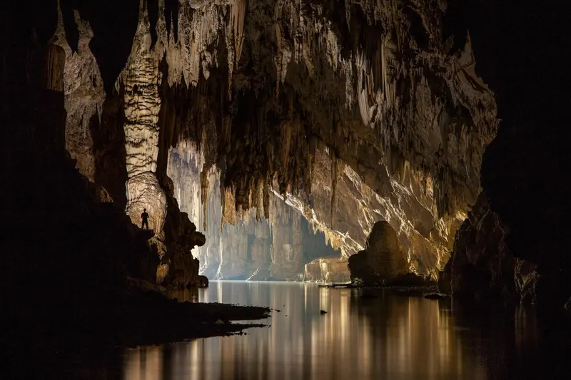 Light streaming into a huge cave chamber
