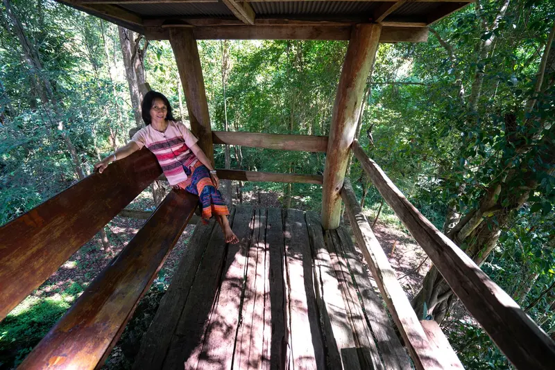 Relaxing on a bungalow balcony among the trees