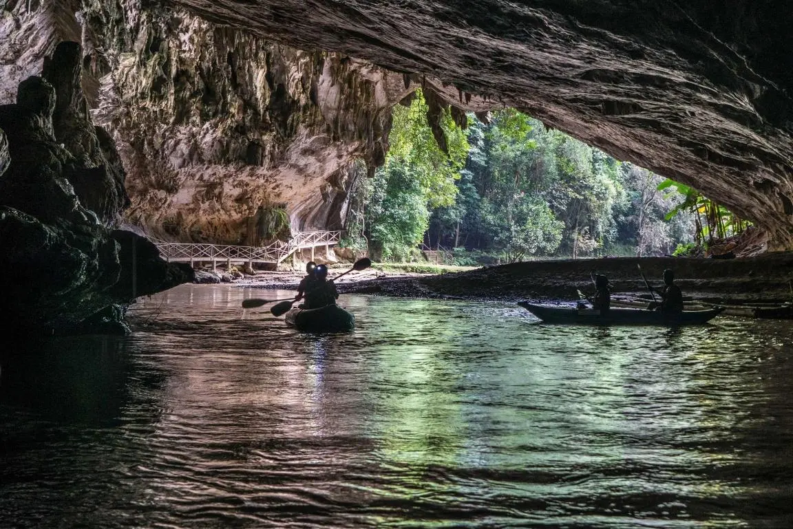 Kayaking out of Tham Lod cave