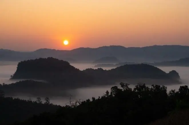Sunrise over a sea of fog in Pang Mapha