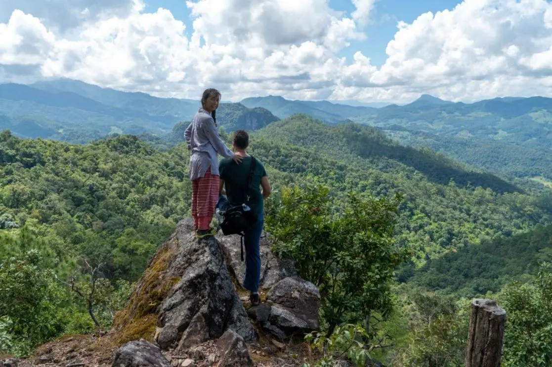 Trekkers at a viewpoint on the high ridge