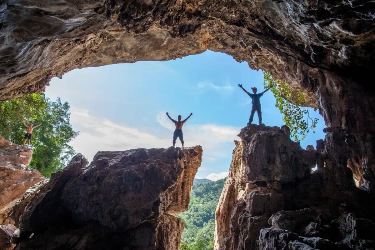 Cavers standing in the Red Cliff Cave arch